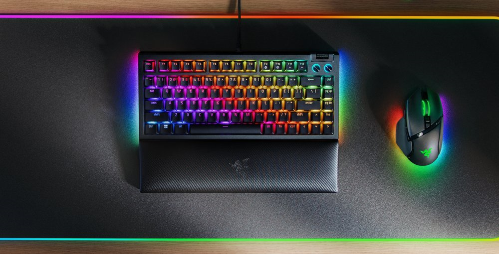 A rainbow colored keyboard on a mouse pad

Description automatically generated