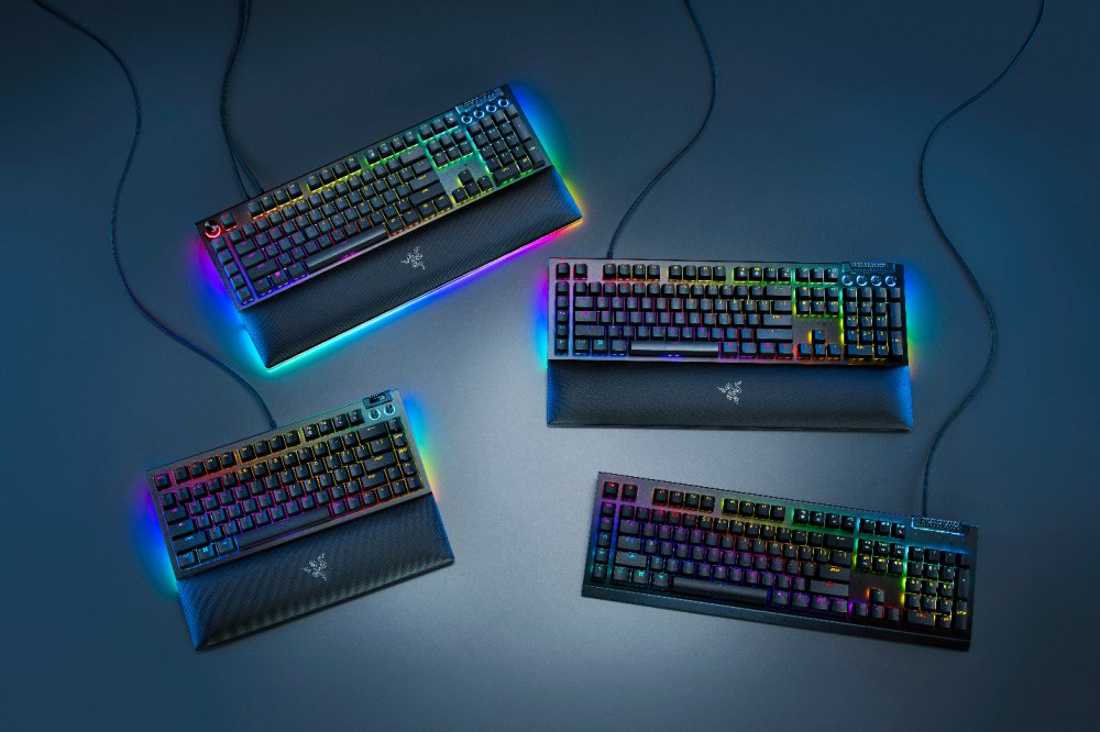 A group of keyboards with colorful lights

Description automatically generated