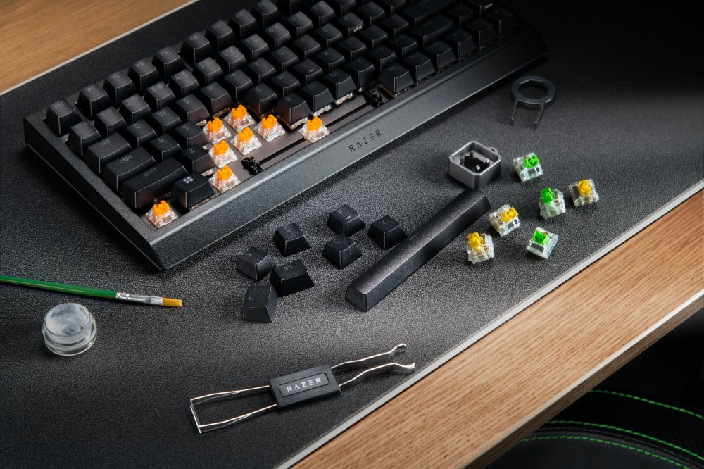 A keyboard and tools on a desk

Description automatically generated