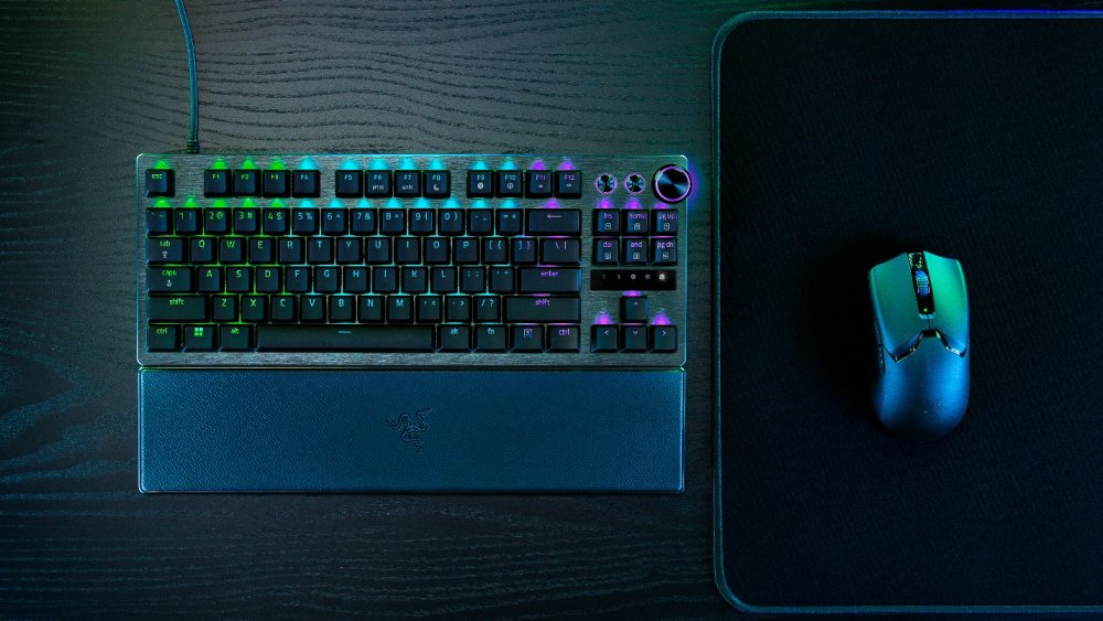 A keyboard and mouse on a mouse padDescription automatically generated
